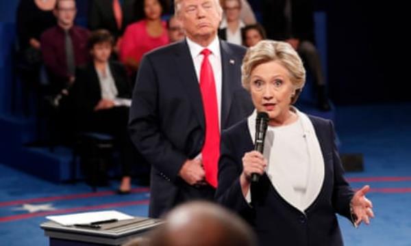 Hillary Clinton speaks as Donald Trump listens during a presidential debate