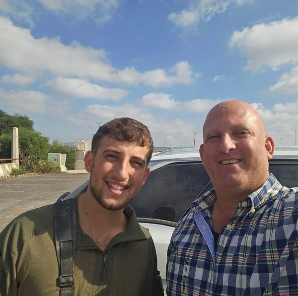 Staff Sergeant Roey Weiser, 21, with his father Yami Weiser