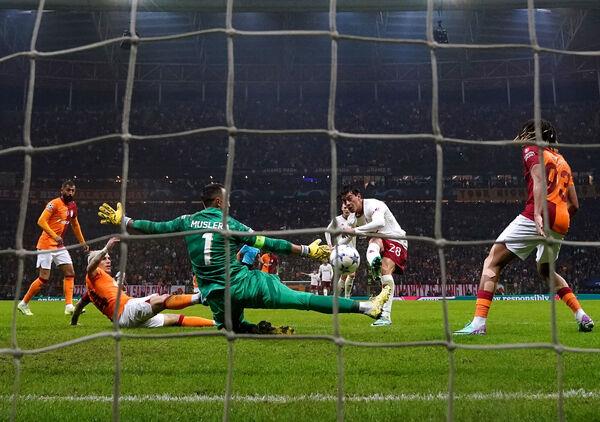 Galatasaray goalkeeper Fernando Muslera saves a shot from Manchester United's Facundo Pellistri. Photo credit: Nick Potts/PA Wire. Galatasaray goalkeeper Fernando Muslera saves a shot from Manchester United's Facundo Pellistri. Photo credit: Nick Potts/PA Wire.